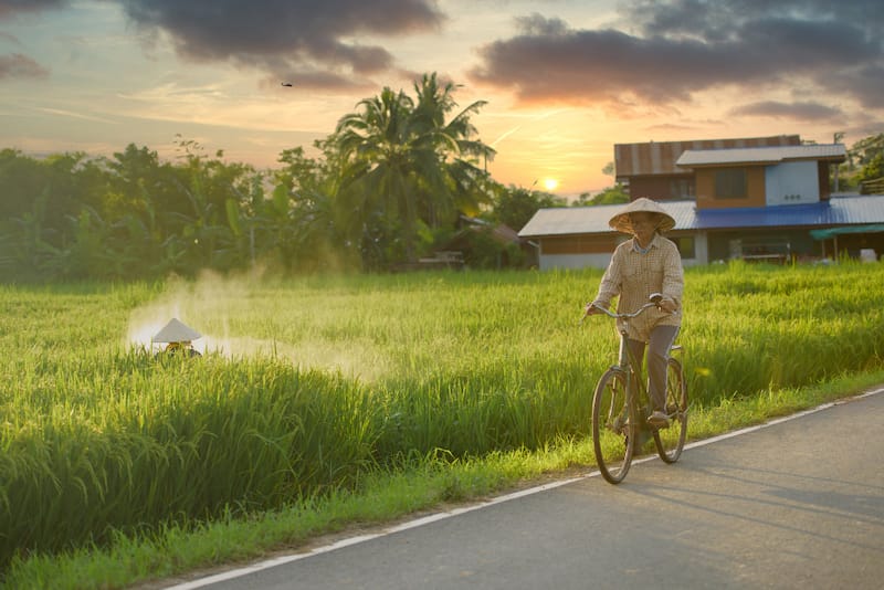 vietnam-bike-tour-farmer-riding-bike-vietnamese.jpg